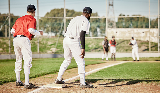 Sports, baseball and teamwork with men on field for training, competition matcha and exercise. Home run, focus and fitness with group of people playing in park stadium for pitcher, cardio and batter