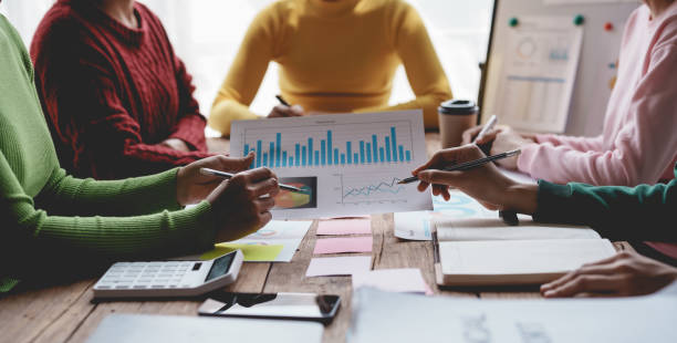 istock Business people meeting explaining the financial graph data and marketing plan. Group of business people at meeting assessment the state of business investment and marketing. 1607358649