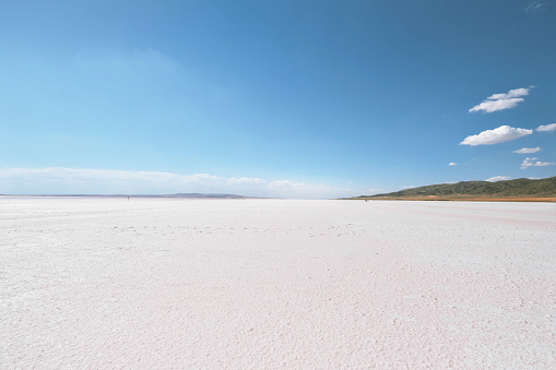 Ankara, Turkey - June 16, 2023: Beautiful empty landscape of white salt lake desert with blue sky