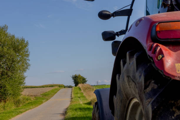 istock tractor on the dirt road 1607363717