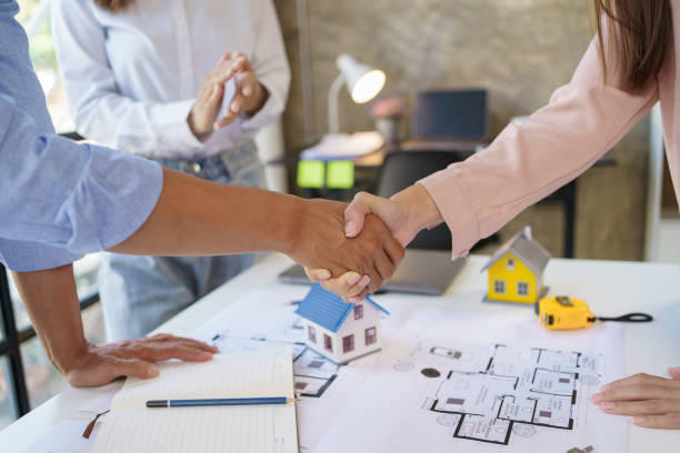 istock Architect and engineer work together and shaking hands to welcome home design projects to work in the same way and work together as a team. 1607370662