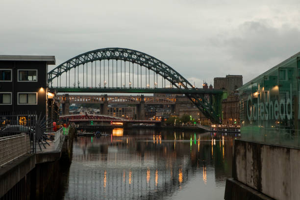 Newcastle United Kingdom aerial shot of panoramic view of the river Tyne with the iconic Tyne Bridge and city area at night