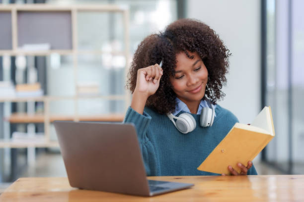 istock Happy young woman student having video call on laptop computer. 1607371763