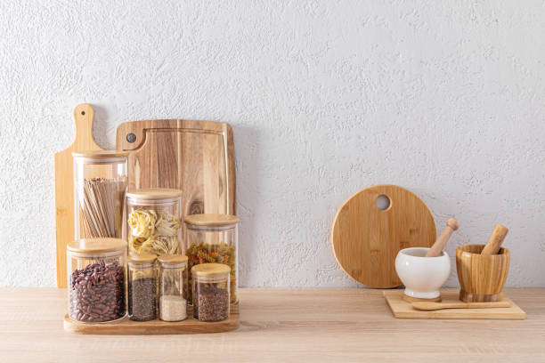 istock eco-friendly tools on the kitchen wooden countertop against a gray textured wall. jars for storing bulk products. modern kitchen space 1607376118