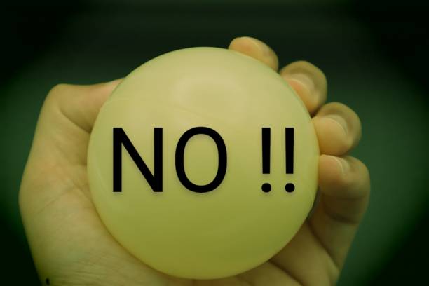 istock A person holding a ball that says NO 1607376627