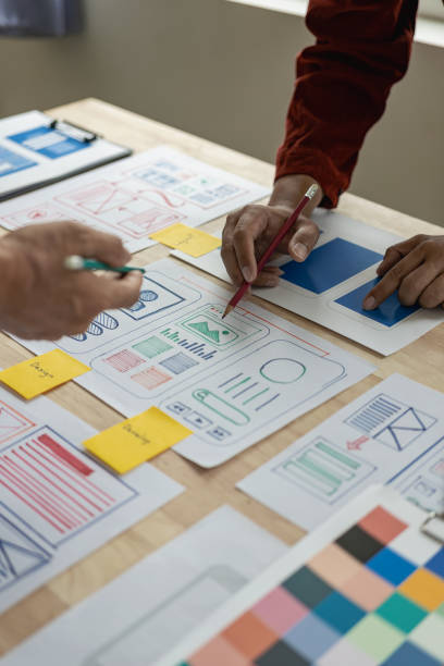 istock The web ux ui design team is writing code and layers to customize the smartphone front ux ui display. To develop mobile responsive websites with previews. vertical image 1607390971
