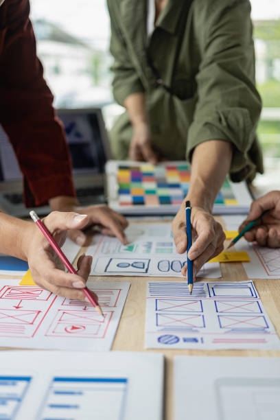 istock The web ux ui design team is writing code and layers to customize the smartphone front ux ui display. To develop mobile responsive websites with previews. vertical image 1607390976