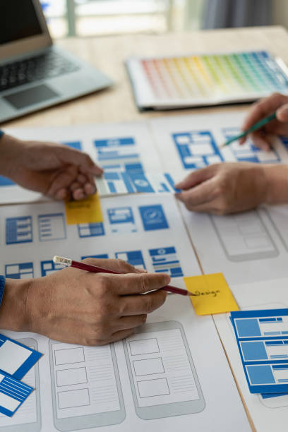 istock The web ux ui design team is writing code and layers to customize the smartphone front ux ui display. To develop mobile responsive websites with previews. vertical image 1607391493