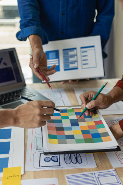 istock The web ux ui design team is writing code and layers to customize the smartphone front ux ui display. To develop mobile responsive websites with previews. vertical image 1607394315