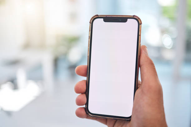 istock Hand, blank phone screen and business man with mock up space, web design or ux for mobile app logo in office. Person pov, smartphone and ui for brand, promotion and networking in financial workplace 1607400808