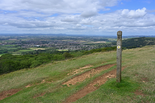 Signpost on the Cotswold Way near Cheltenham, Gloucestershire, England. The Cotswold Way is one of the English national trails.