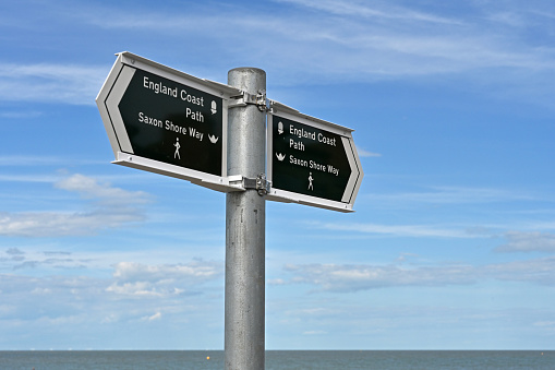 Signpost marking the England Coast Path and Saxon Shore Way near Herne Bay in Kent, England