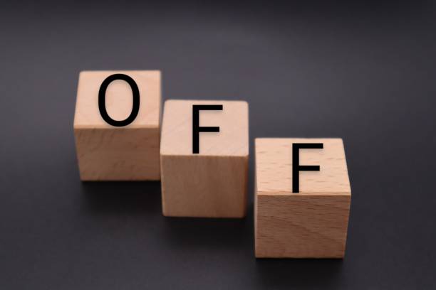 istock A building block with OFF written on it 1607447075