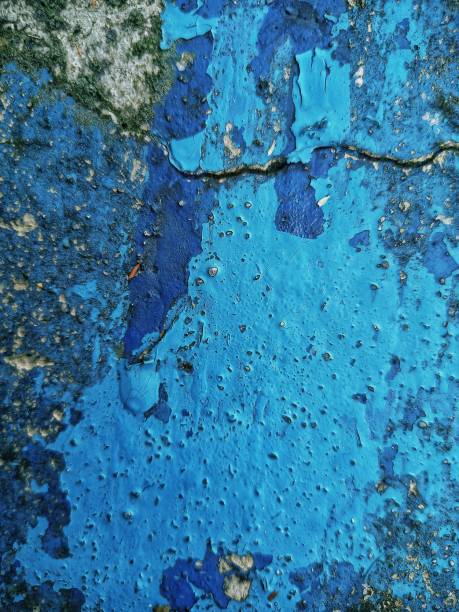 istock Selective focus of a wall texture painted with blue color. 1607482174