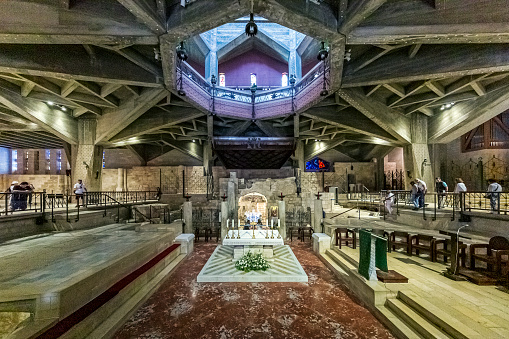 The Church of the Annunciation in Nazareth, Israel, is a revered Christian religious site that commemorates the announcement of the Virgin Mary's impending conception of Jesus by the angel Gabriel. It is one of the most significant holy places in Christianity. The church's architecture combines modern and traditional elements, and its focal point is the Grotto of the Annunciation, believed to be the location where the angel delivered the message to Mary. The site attracts pilgrims and visitors from around the world, reflecting its importance as a place of devotion and historical significance within the Christian faith.