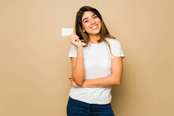 Young woman with a blank credit card