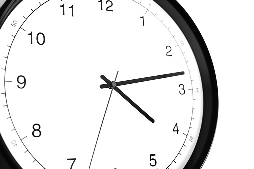 Part of analogue plain wall clock on white wall background. Four o'clock twelve minutes. Close up with copy space, timing, time management, opening hours time, school concept and lunch time