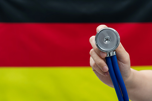 Stethoscope in front of German flag.