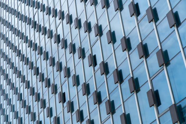 istock modern office building exterior with glass windows. 1607560761
