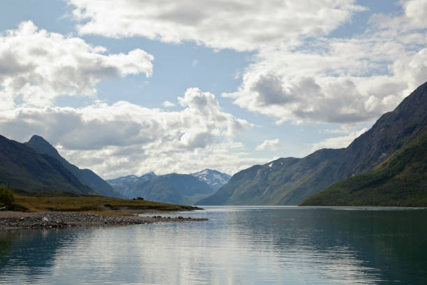 istock Lake in the mountains with skies reflected in water. 160756761