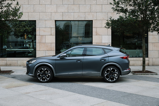 Santander, Spain - 10 August 2023: Side view of a Cupra Formentor SUV car  in a city street