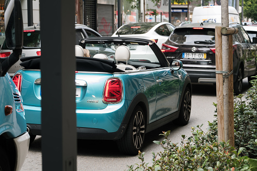 Santander, Spain - 10 August 2023: A traffic jam in a city with diverse traffic, including a convertible Mini Copper