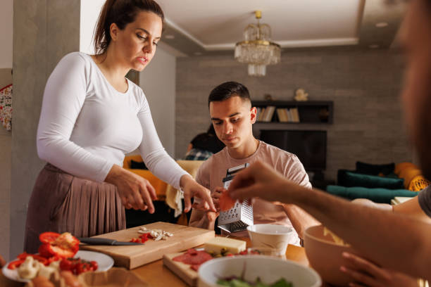istock Joined efforts when making pizzas and hanging out 1607595793
