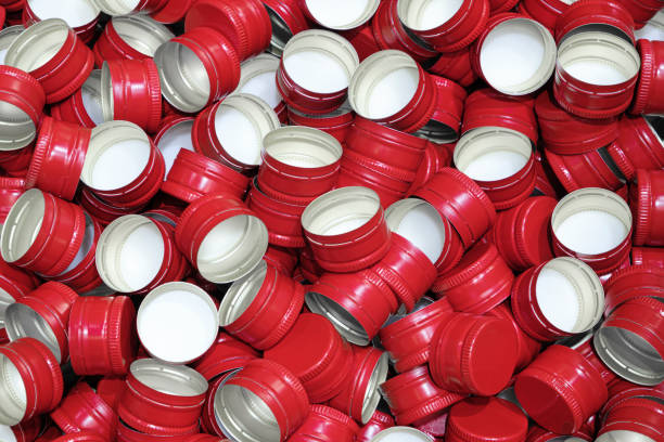 istock Pile of bottle red metal screw caps as pattern background 1607603412