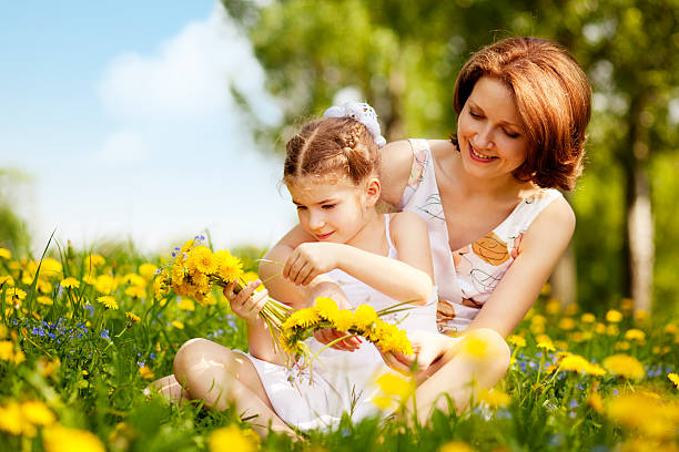 istock Mother and daughter having fun in park 160760420