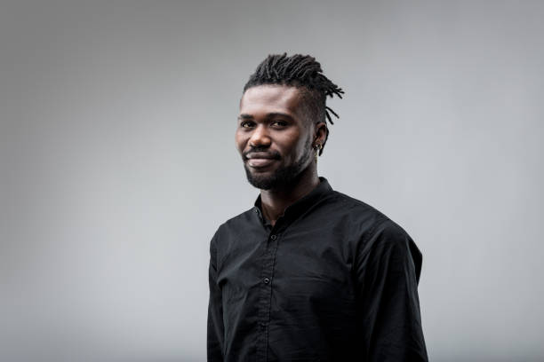 istock Three-quarter view, black man, smile, attentive 1607604543