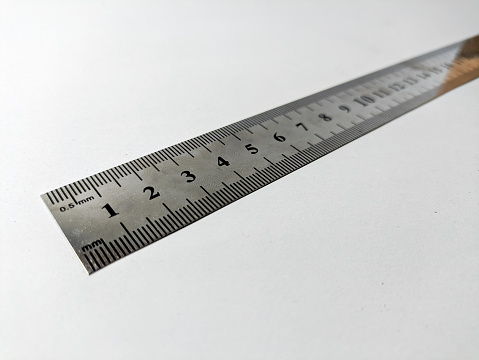 Iron ruler isolated on a white background.