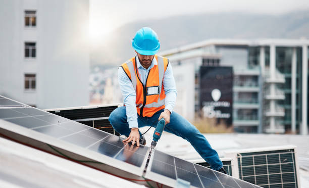 istock Technician man, drill and solar panel on roof with installation, sustainability and construction in city. Engineer, tools and photovoltaic system with building, development or renewable energy in cbd 1607632495