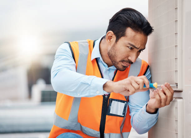 istock Tools, engineering and man with air conditioner panel for repair, maintenance and inspection on roof. Heating, technician and male worker with equipment for service, installation or electricity check 1607633065