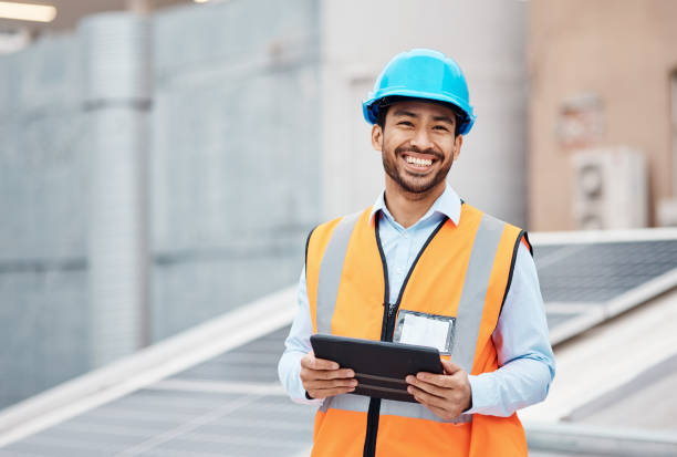 Construction worker, tablet and portrait of man with research and digital data for solar panel installation. Happy, engineer and male contractor with eco and energy project with tech and online plan Construction worker, tablet and portrait of man with research and digital data for solar panel installation. Happy, engineer and male contractor with eco and energy project with tech and online plan electrician smiling stock pictures, royalty-free photos & images