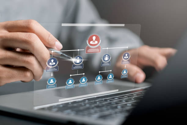 istock Human Resources Manager working with HR organizational diagram, organization chart with hierarchy structure of teams and employees in company, business process and workflow automation with flowchart. 1607633643