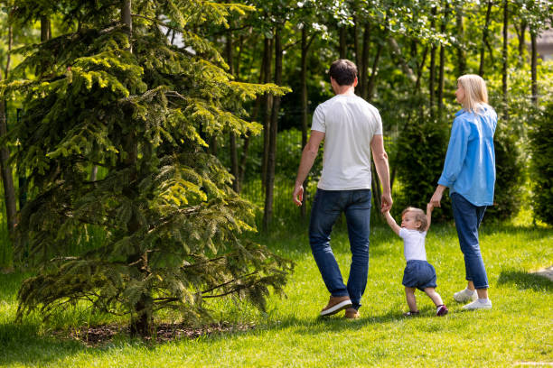 istock Parents having a walk with their cute little son 1607647122