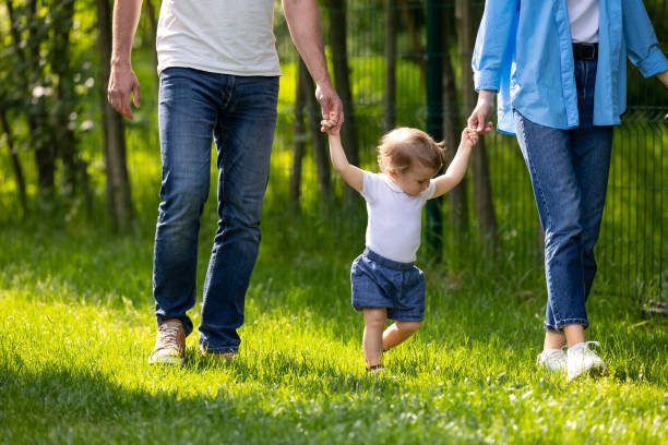 istock Parents having a walk with their cute little son 1607647146