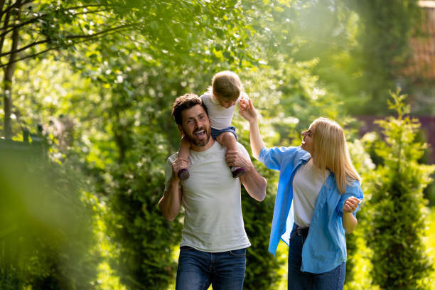 istock Parents and their cure kid spending time in the park 1607647676