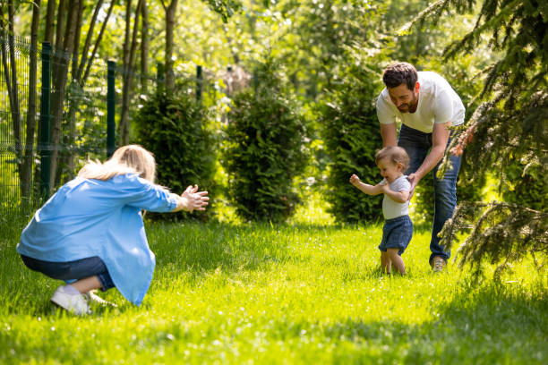 istock Cute young family spending time together in the park 1607647680