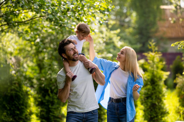 Parents and their cure kid spending time in the park