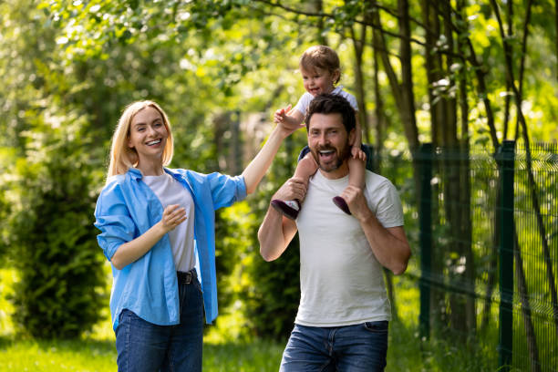 istock Parents and their cure kid spending time in the park 1607647688