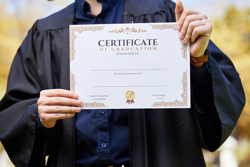 University, hands and closeup of a graduate with a degree for success, achievement or goal. Scholarship, college and zoom of student or person holding certificate or diploma scroll for education.