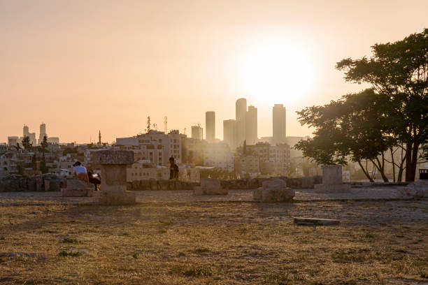 The Amman Citadel, also known as Jabal al-Qal'a, is an archaeological site perched atop a hill in the heart of Amman, Jordan. This ancient citadel holds significant historical and cultural importance, representing the layers of civilizations that have occupied the area for millennia.\n\nThe Citadel features a variety of ruins and structures from different periods, showcasing the remnants of past civilizations including the Roman, Byzantine, and Islamic eras. The most iconic structure is the Temple of Hercules, with its towering columns and a hand-shaped stone carved into the ground. The Umayyad Palace and the Byzantine Church are also notable features of the site.\n\nApart from the historical structures, the Citadel offers breathtaking panoramic views of Amman and its modern cityscape. The Archaeological Museum within the Citadel showcases artifacts excavated from the site and provides insight into the history of the region.\n\nAs a historical and cultural treasure, the Amman Citadel provides visitors with a unique opportunity to explore Jordan's rich history, witness the layers of civilizations that have shaped the region, and appreciate the stunning views from its elevated position.\n\nThis picture captures the sunset in Amman Citadel.