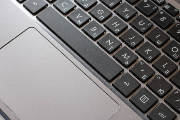 istock Laptop keyboard black on gray background. 1607674636