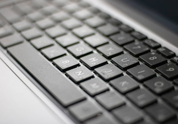 istock Laptop keyboard black on gray background. 1607675158