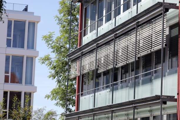 blinds on an office building to protect against the sun stock photo