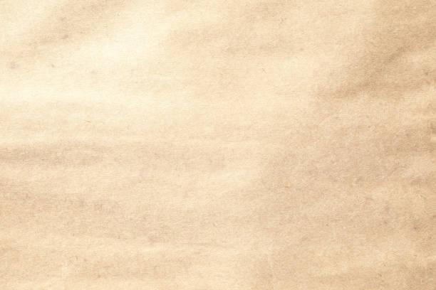istock Grainy kraft brown paper texture 1607680569
