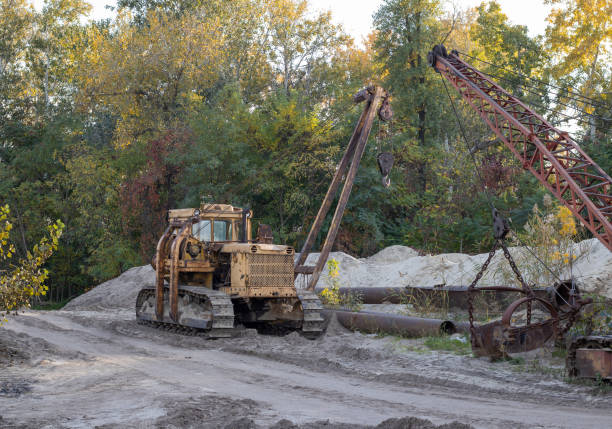 istock Bulldozers standing in the sand quarry. 1607686170