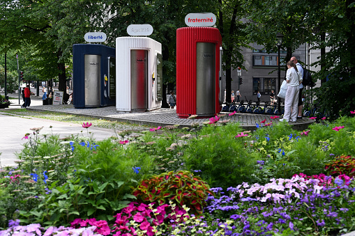 oslo, Norway, July 3, 2023 - Public toilets (Tricolore toilets) in Oslo city at Spikersuppa park with colors of the French national flag and the national motto of France liberty, equality, fraternity