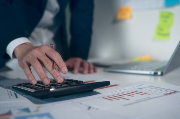istock Research Financial and Accounting concept, Accountant using calculator for calculate finance report in office, analyst report profits and growth, Market research reports and income statistics 1607726521